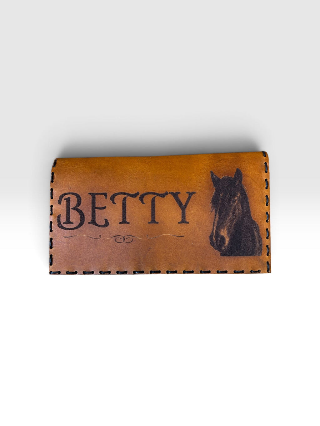 Leather checkbook cover back view showing natural cowhide finish and saddle stitch edges