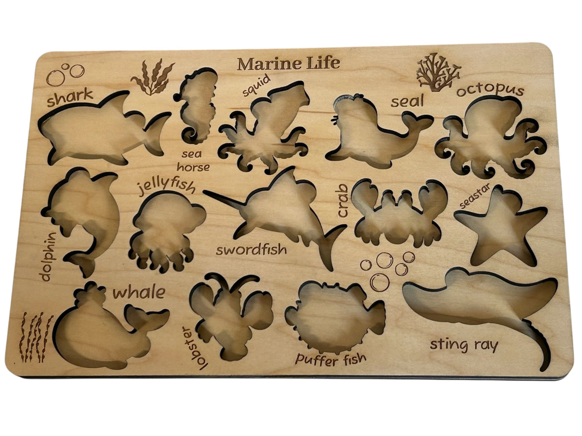 Marine Life wooden puzzle board — empty showing all engraved animal names