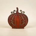 Side profile showing the dimensional layered construction of the wood pumpkin