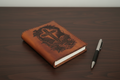 Journal flat on dark desk